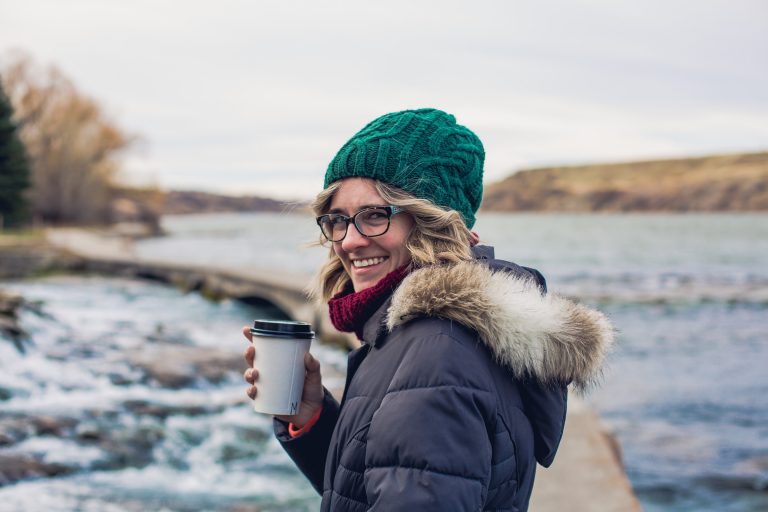 a woman enjoying her cup of coffee