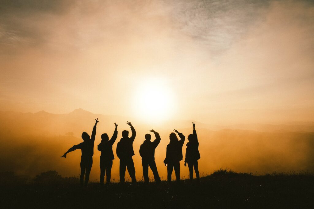 friends having fun on a sunrise