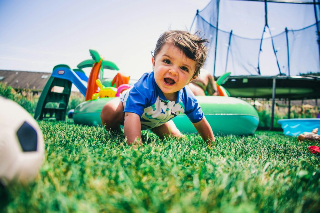 A child crawling in the grass featured image of Where to send a child with behavior problems article